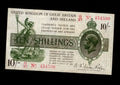 Front of 1923 Great Britain 10 Shillings banknote featuring King George V, Britannia, and serial number G/27 454590
