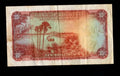 Back of 1956 Rhodesia and Nyasaland 10 Shillings note showing palm trees and a river scene.