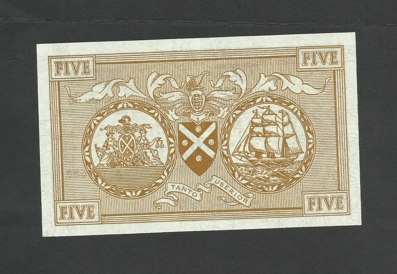 Reverse of a 1963 Scottish 5 Pound note featuring a sailing ship engraving and heraldic shield