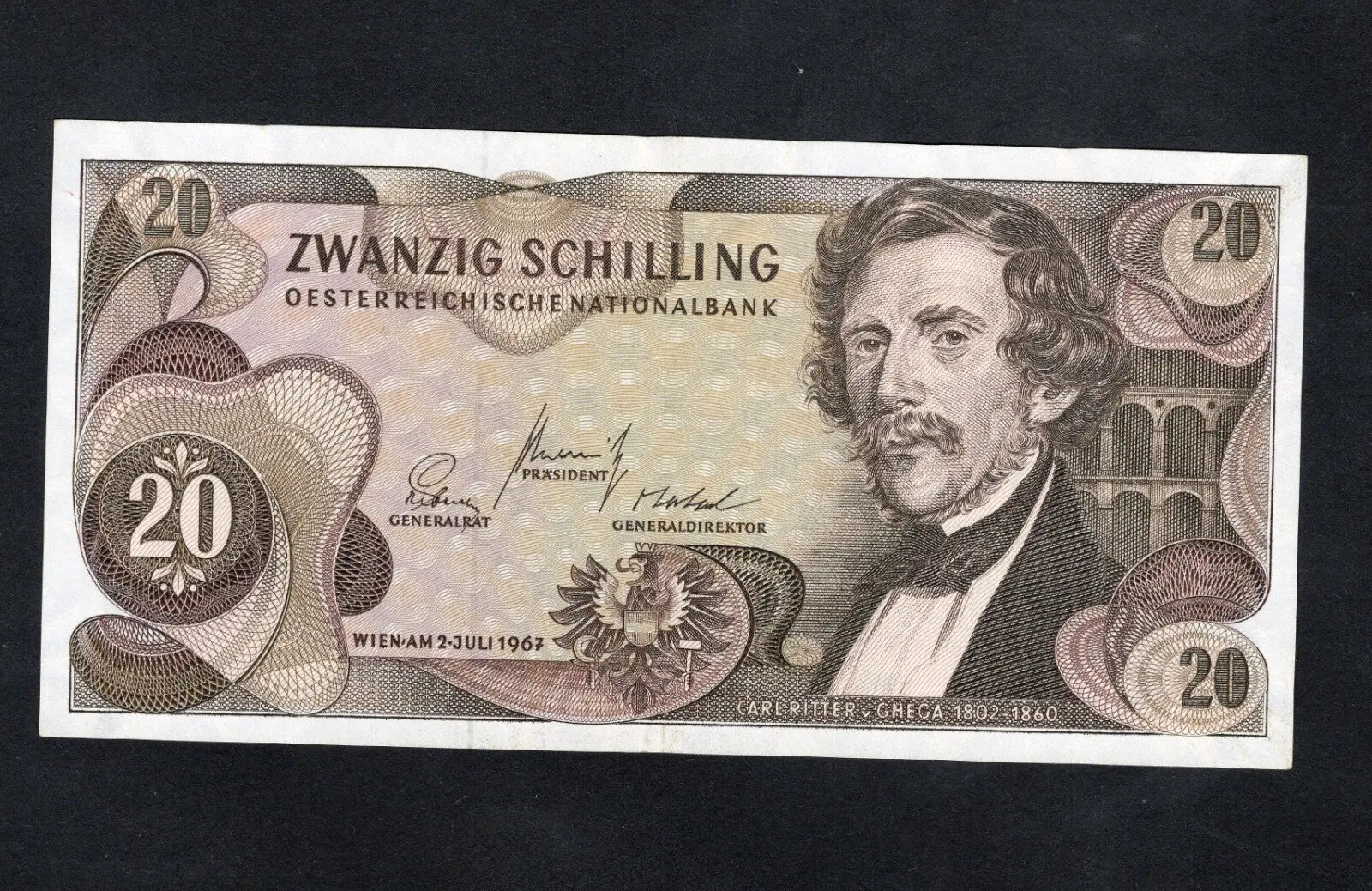 Circulated 1967 Austria 20 Schilling banknote featuring Carl Ritter von Ghega and the Semmering Railway bridge.
