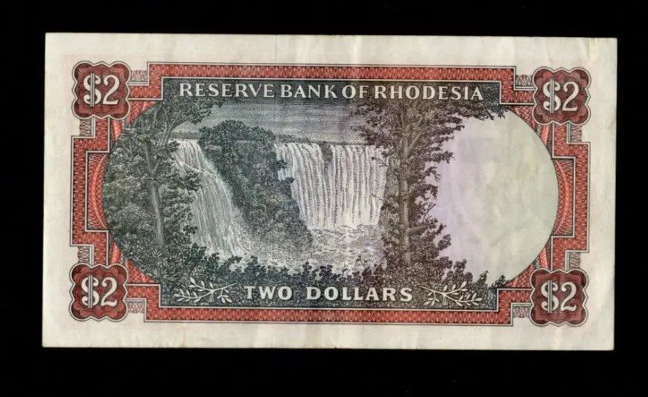 Front of 1977 Rhodesia 2 Dollar banknote featuring a Flame Lily and serial number K/138 935536.