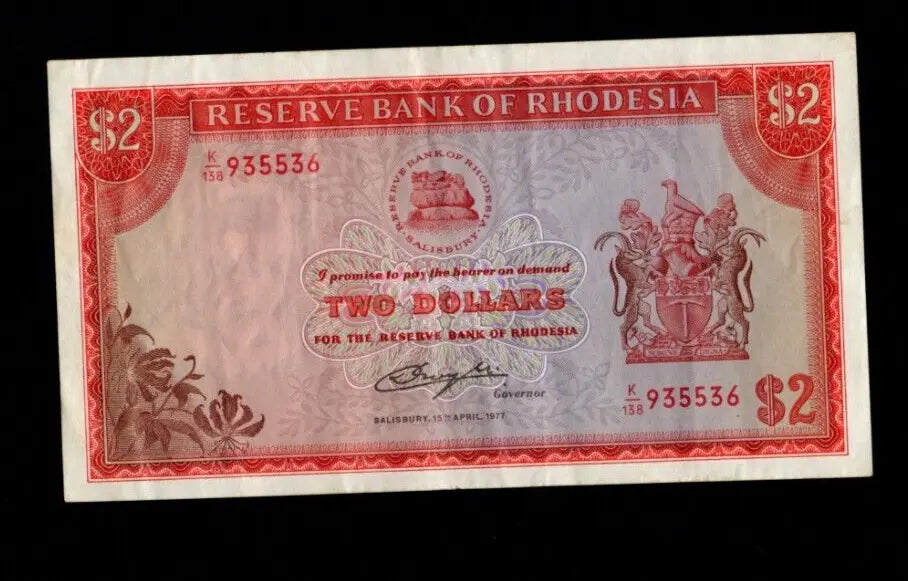 Front of 1977 Rhodesia 2 Dollar banknote featuring a Flame Lily and serial number K/138 935536.