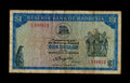 Front of a circulated 1978 Rhodesia 1 Dollar banknote featuring the Balancing Rocks and Coat of Arms.
