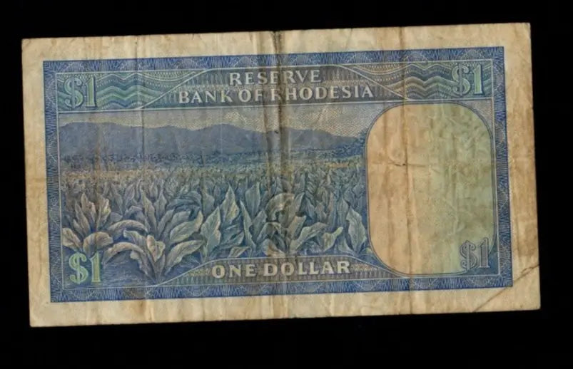 Front of a circulated 1978 Rhodesia 1 Dollar banknote with Balancing Rocks and red serial numbers