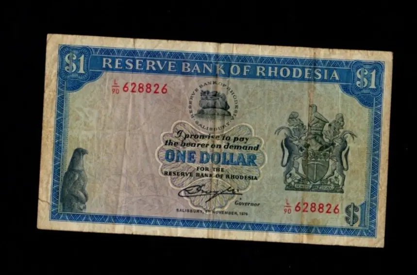 Front of a circulated 1978 Rhodesia 1 Dollar banknote with Balancing Rocks and red serial numbers