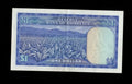 Reverse of 1979 Rhodesia 1 Dollar note showing a tobacco field and mountain landscape.
