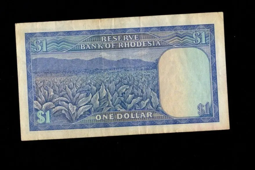 Reverse of 1979 Rhodesia 1 Dollar note showing a tobacco plantation and mountain landscape