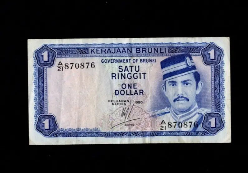 Front of 1980 Brunei 1 Ringgit banknote featuring Sultan Hassanal Bolkiah and serial number A/21 870876