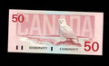 Reverse of 1988 Canada 50 Dollar banknote featuring a Snowy Owl in an Arctic landscape
