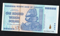 front of Zimbabwe 100 Trillion Dollar banknote. Genuine, AUNC AA Serial Number UV checked
