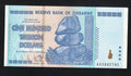 front of Zimbabwe 100 Trillion Dollar banknote. Genuine, AUNC AA Serial Number UV checked