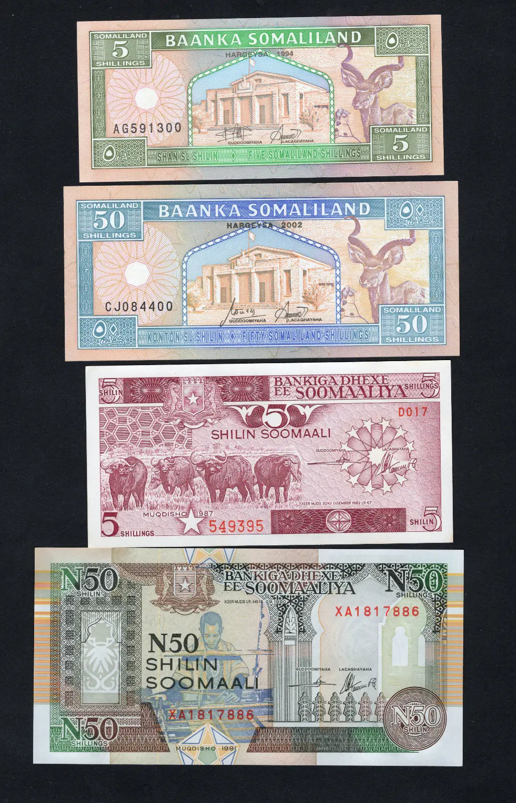  front of 2xSOMALIA ( 5, 50 Shilings )and 2xSomaliland (5, 50 shilings)banknotes