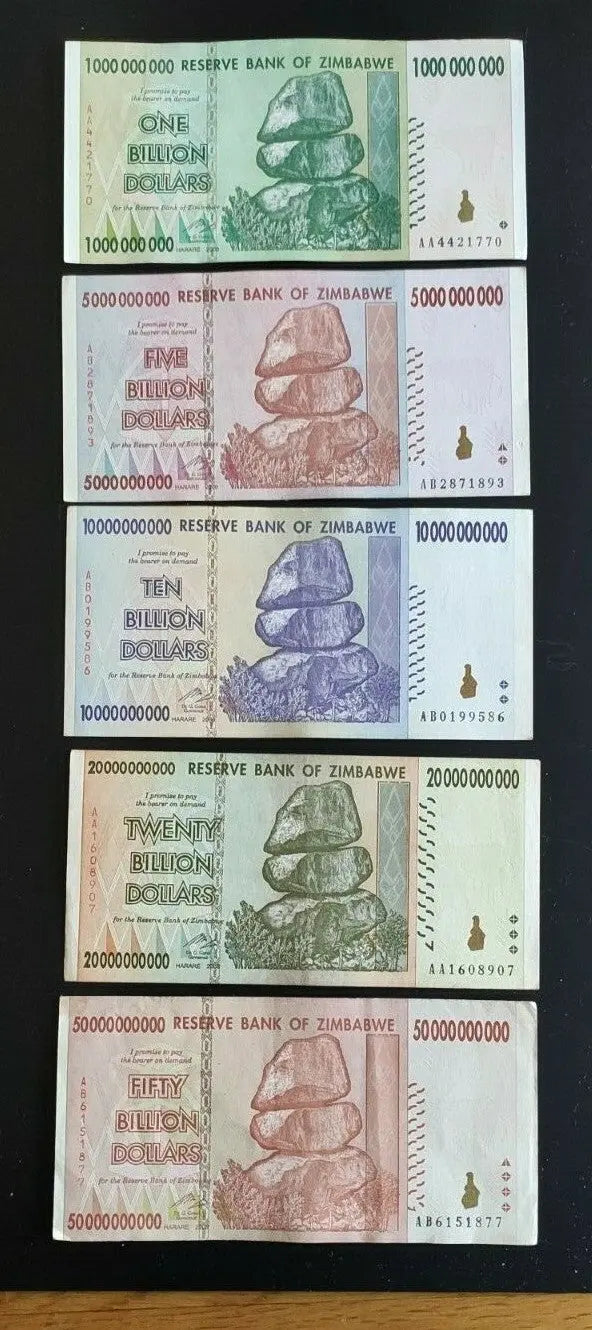 Zimbabwe banknotes set with denominations from 1 to 50 billion dollars, stacked on black background