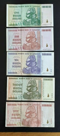 Zimbabwe banknotes set with denominations from 1 to 50 billion dollars, stacked on black background