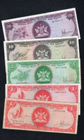 A set of five circulated 1977 Trinidad and Tobago banknotes ($1, $5, $10, $20) featuring the Scarlet Ibis and hibiscus flower designs