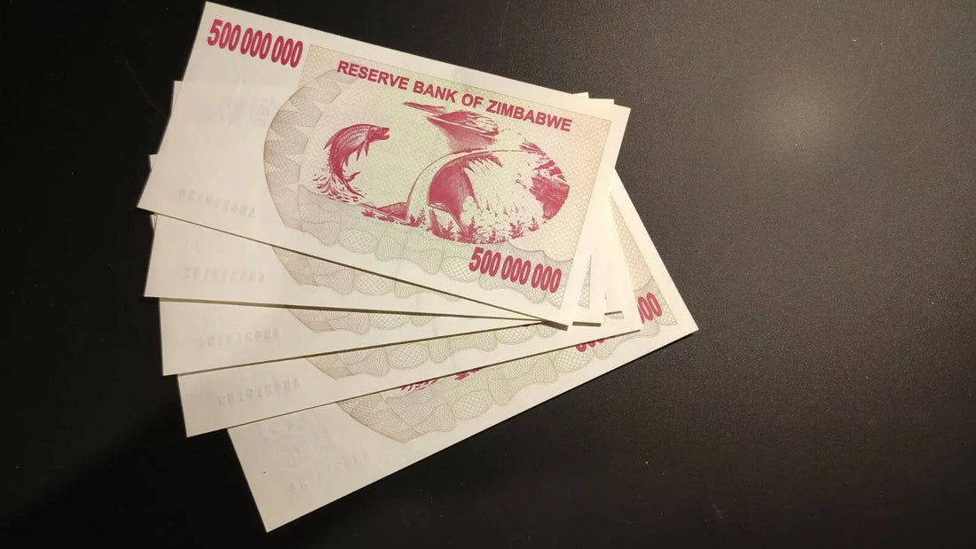 Stack of Zimbabwe 500 million dollar banknotes on black background, collectible currency
