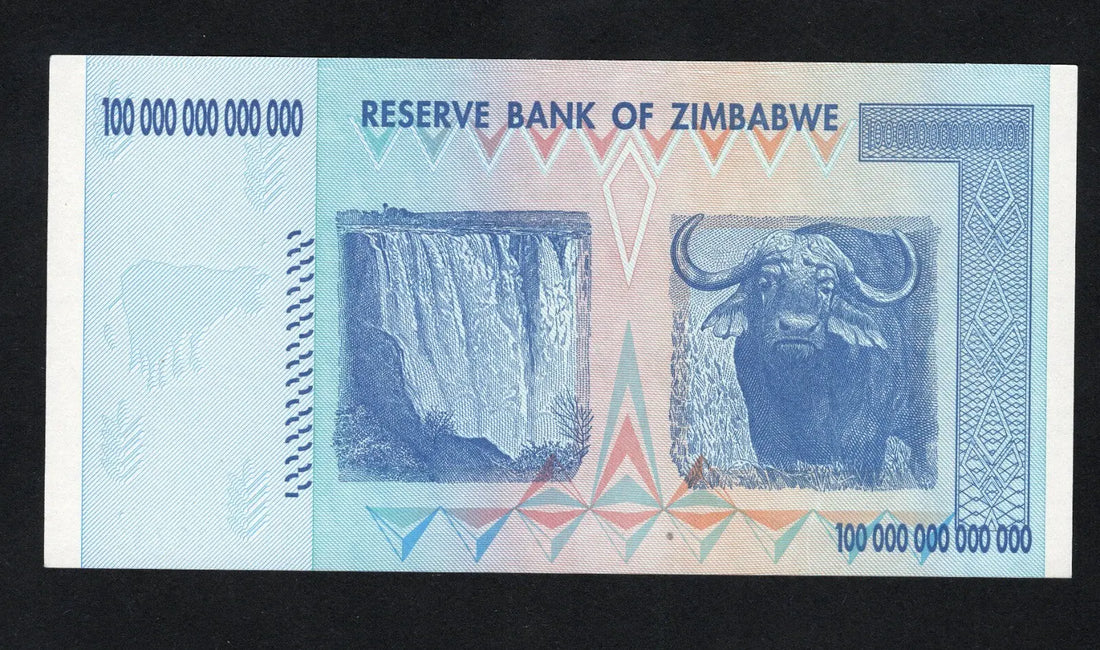 front of Zimbabwe 100 Trillion Dollar banknote. Genuine, AUNC AA Serial Number UV checked
