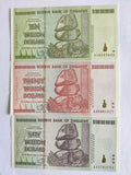 Zimbabwe banknotes ten, twenty, fifty trillion dollars with balancing rocks design