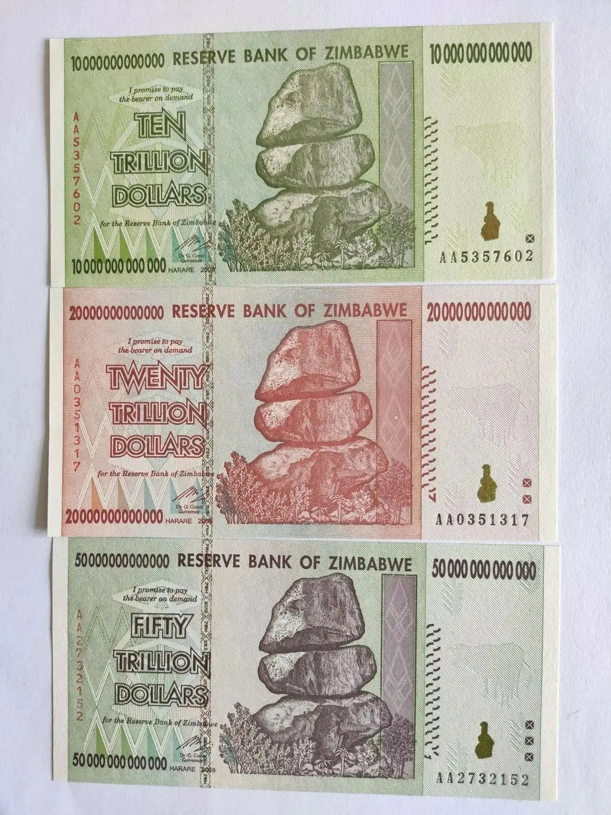 Zimbabwe banknotes ten, twenty, fifty trillion dollars with balancing rocks design