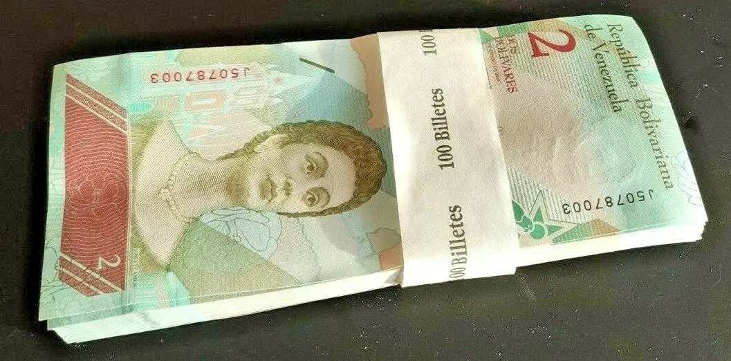 Bundle of 100 Venezuelan 2 bolivar banknotes featuring portrait, for currency collectors