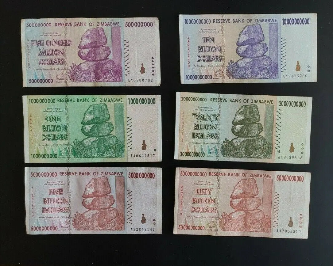 Zimbabwe hyperinflation banknotes collection, denominations from 500 million to 50 billion dollars on black background.