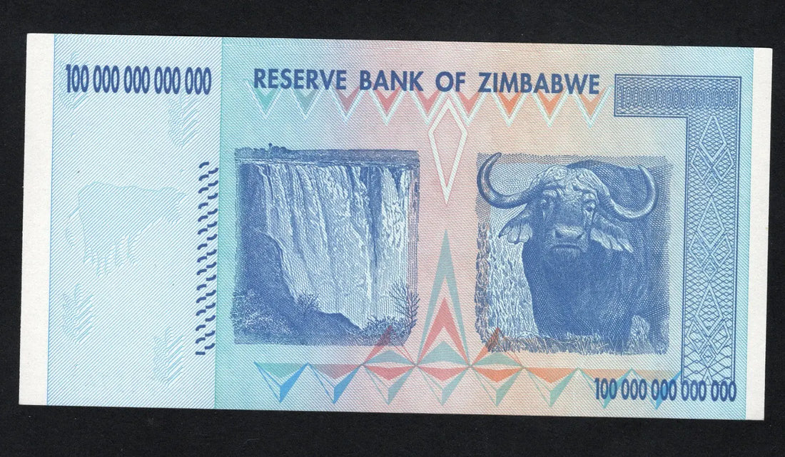 front of Zimbabwe 100 Trillion Dollar banknote. Genuine, AUNC AA Serial Number UV checked