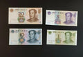 Chinese yuan banknotes in 20, 10, 5, and 1 denominations on a black background