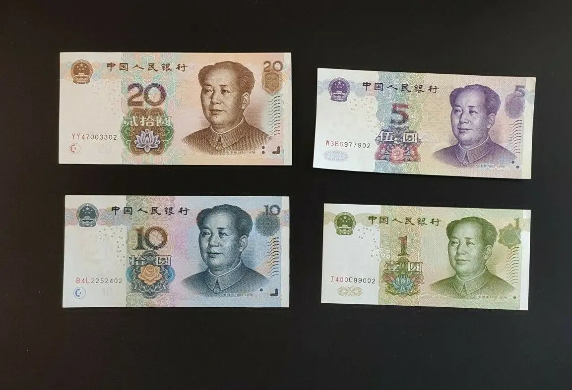 Chinese yuan banknotes in 20, 10, 5, and 1 denominations on a black background