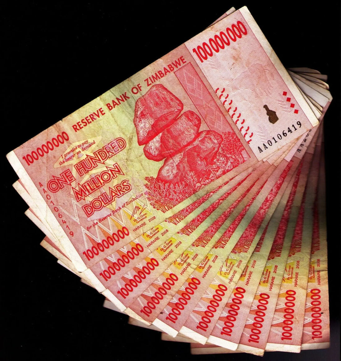 Fan of Zimbabwe 100 million dollar banknotes with Chiremba Balancing Rocks, collectible currency