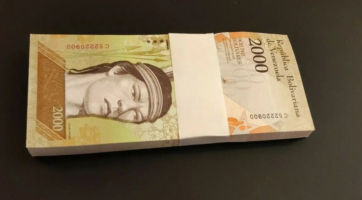 Stack of Venezuela 2000 Bolívares banknotes featuring indigenous portrait, collectible currency