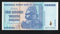 front of Zimbabwe 100 Trillion Dollar banknote. Genuine, AUNC AA Serial Number UV checked