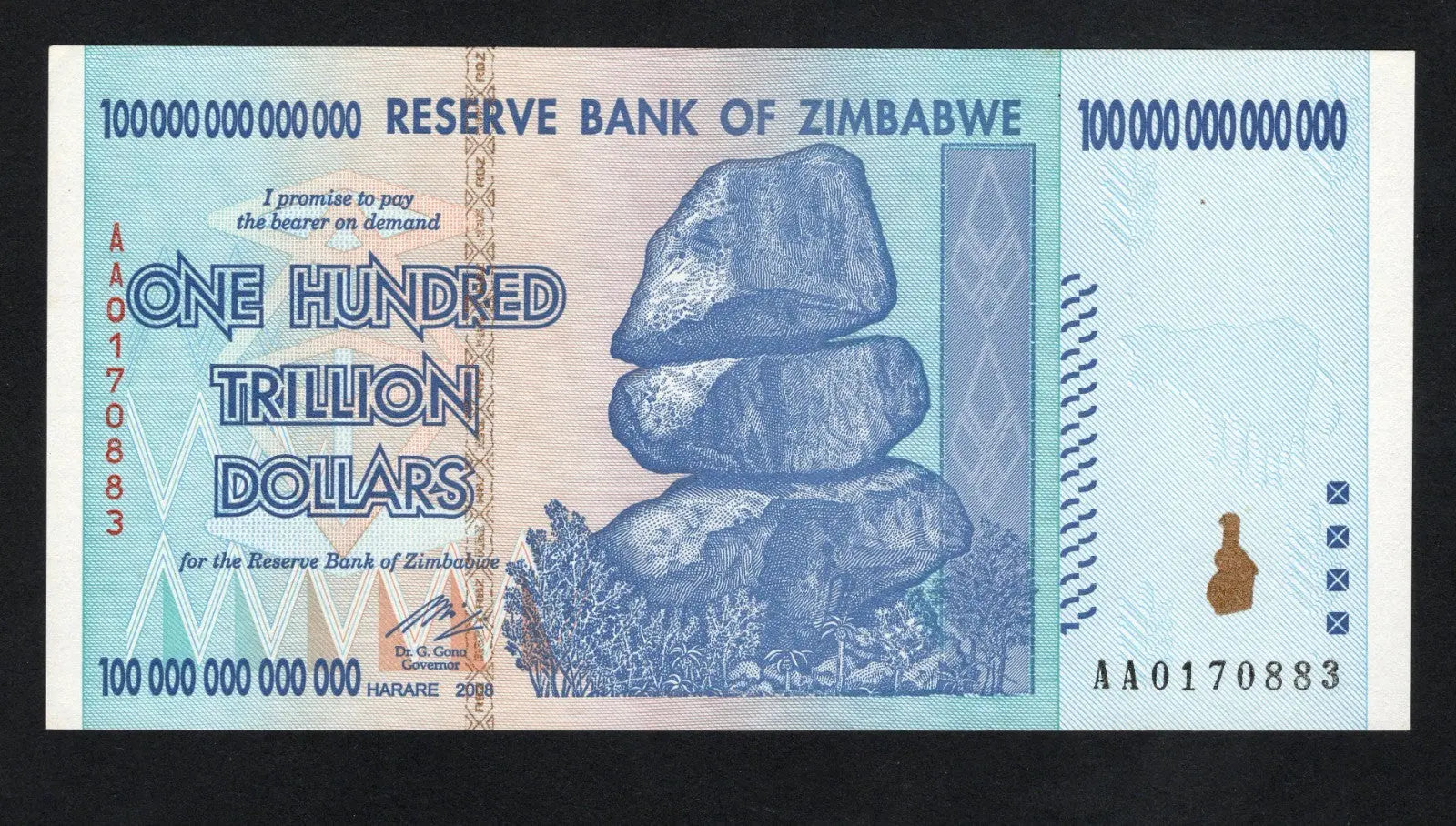 front of Zimbabwe 100 Trillion Dollar banknote. Genuine, AUNC AA Serial Number UV checked