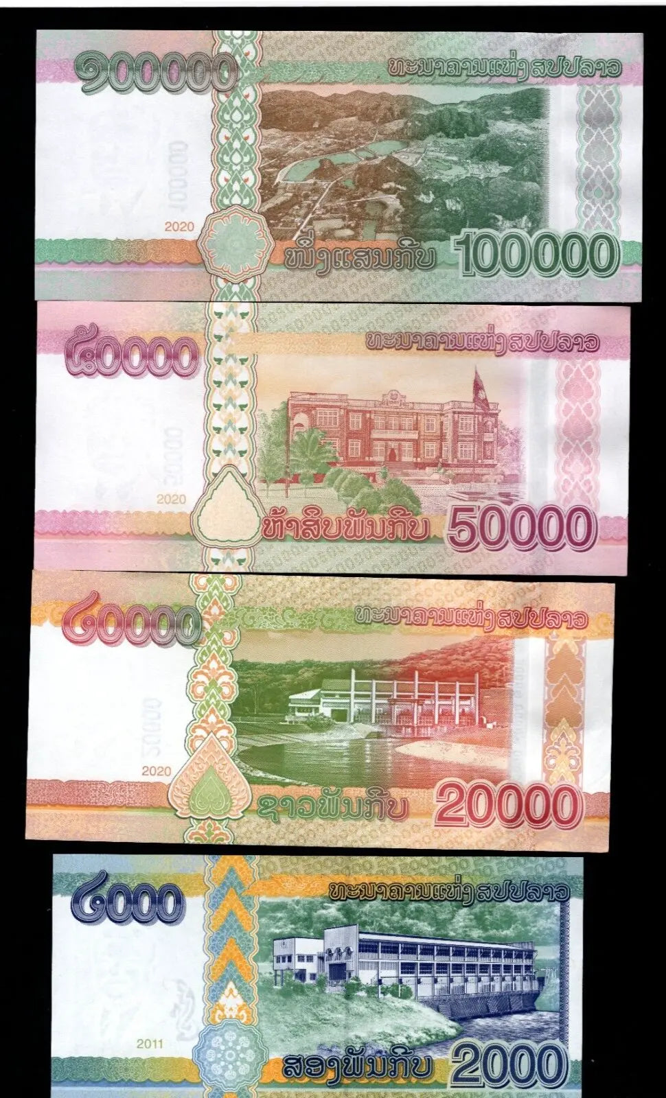 A set of 4 Laotian Kip banknotes featuring President Kaysone Phomvihane in various denominations and colors.