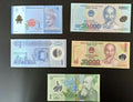 Assorted world banknotes from Malaysia, Vietnam, Libya, and Romania on black background