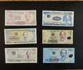 Vietnamese banknotes collection, various denominations with prominent portrait on black background