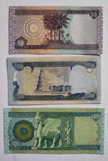 Iraqi banknotes of 50, 250, and 500 dinars featuring historic landmarks and intricate designs