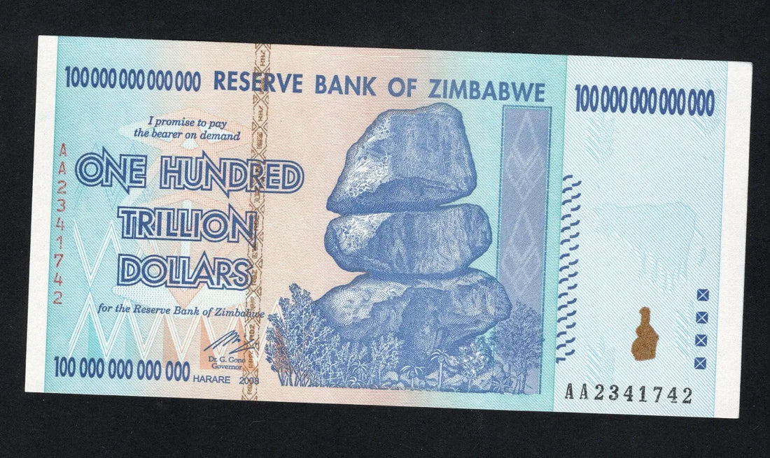 front of Zimbabwe 100 Trillion Dollar banknote. Genuine, AUNC AA Serial Number UV checked