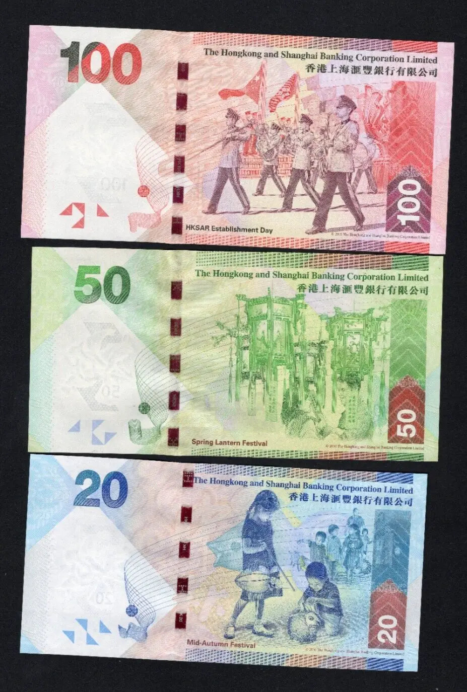 A set of 3 HSBC Hong Kong banknotes ($20, $50, $100) featuring the HSBC lion mascot and headquarters building.
