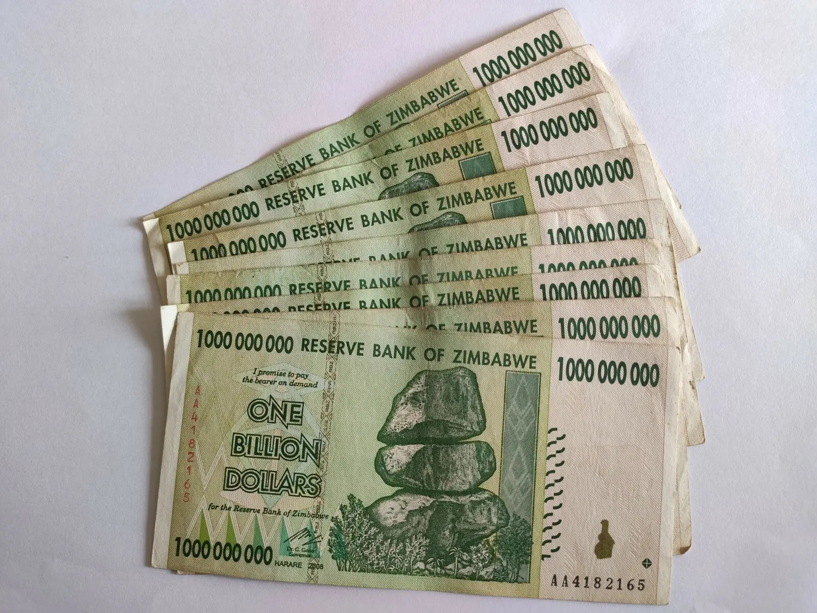 Stack of Zimbabwe one billion dollar banknotes, unique collectible currency notes.
