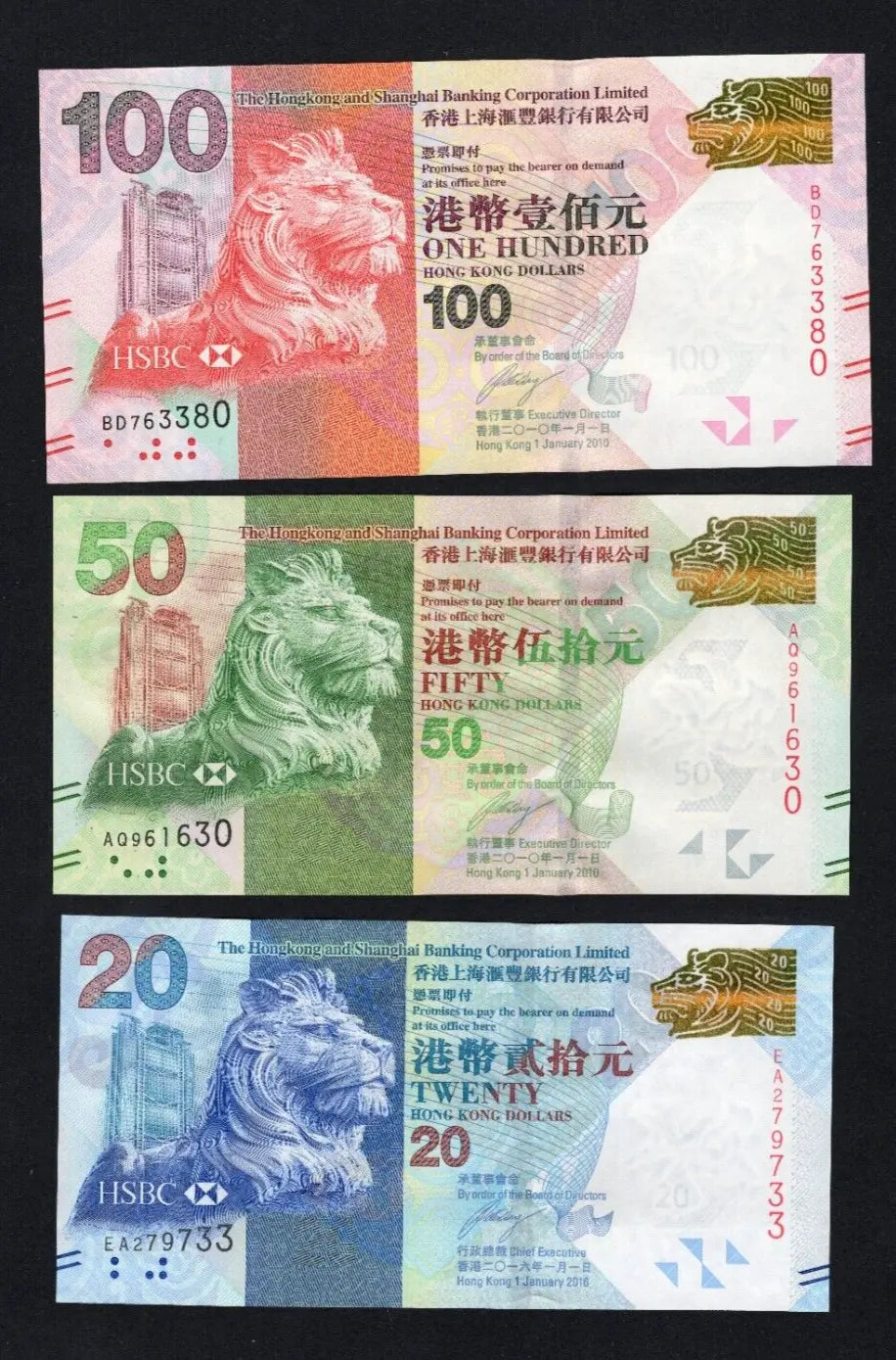 A set of 3 HSBC Hong Kong banknotes ($20, $50, $100) featuring the HSBC lion mascot and headquarters building.