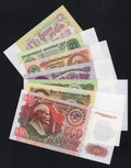 A collection of seven authentic Soviet and Russian banknotes including 1, 3, 10, 25, 50, 100, and 500 Rubles from 1961 to 1992.