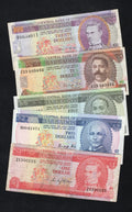 A set of five circulated Barbados banknotes in various colors ($1, $2, $5, $10, and $20) displayed together.