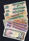 A 12-piece collection of circulated Dominican Republic banknotes from 1 to 500 Pesos Oro, shown in a fanspread.