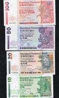 A set of 4 Hong Kong Standard Chartered banknotes ($10, $20, $50, $100) featuring mythical creatures like the Dragon Turtle and Kirin.