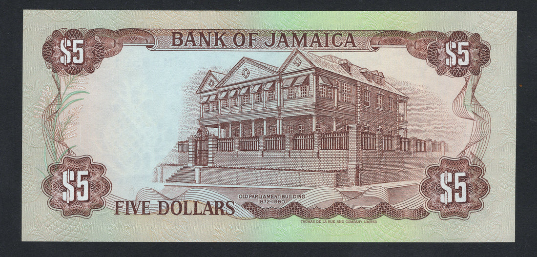 Five dollars banknote from the Bank of Jamaica with a portrait and emblem.