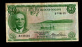 Front and back of an authentic, circulated 1964 Malawi 1 Pound banknote featuring President Hastings Banda and tobacco harvesting.