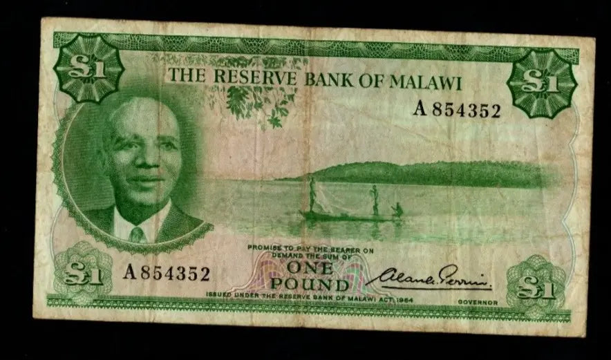 Front and back of a circulated 1964 Malawi 1 Pound banknote featuring President Hastings Banda and Lake Malawi.