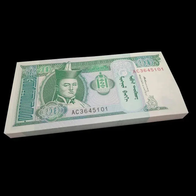 A brick bundle of 100 uncirculated 1993 Mongolia 10 Tögrög banknotes featuring Damdin Sükhbaatar and horses
