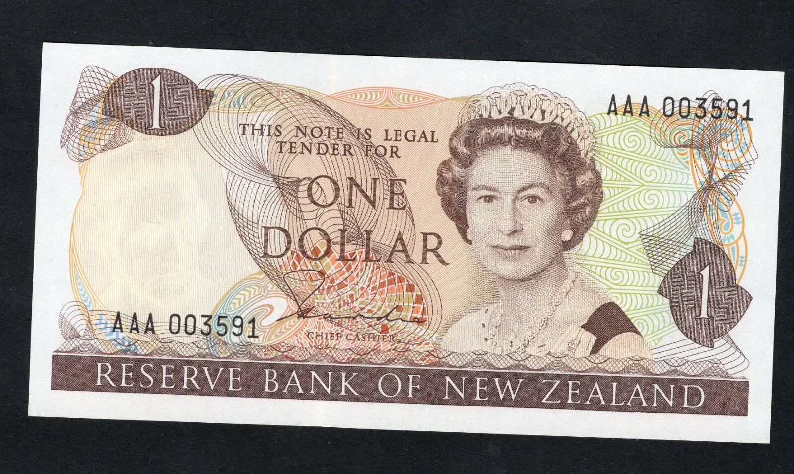 Front and back of an uncirculated New Zealand 1 Dollar banknote featuring Queen Elizabeth II and the native Fantail bird.