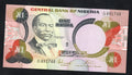 Actual photo of Nigeria 1 Naira 1979 banknote, Pick 21, Serial Number L/29 491748, featuring Herbert Macaulay in Uncirculated condition.